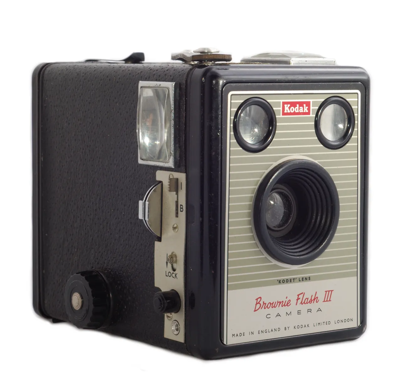 A real Kodak Brownie Flash III box camera, shown for reference against the boxy in-game design
